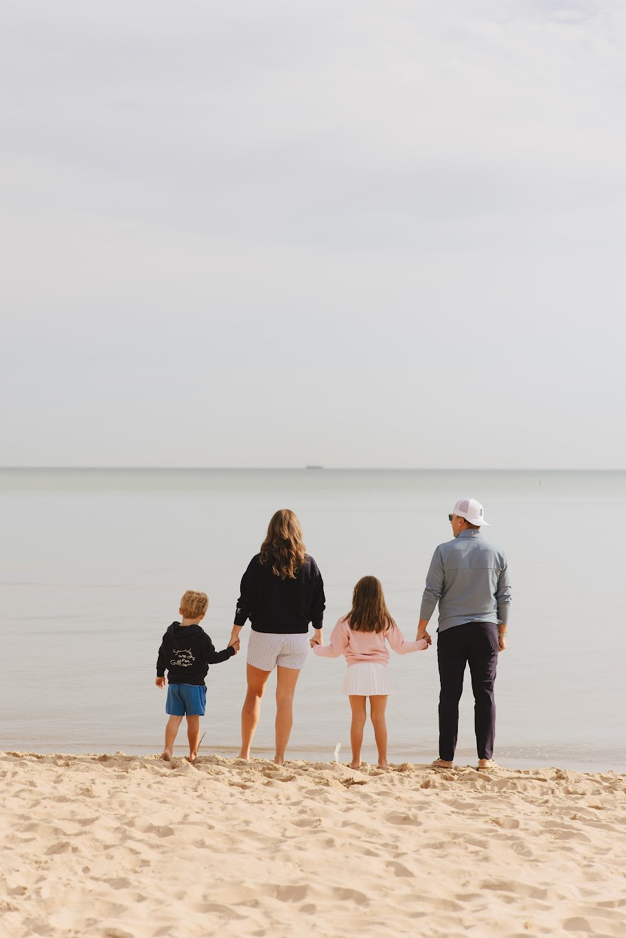 The Herrmann family at the edge of Lake Michigan